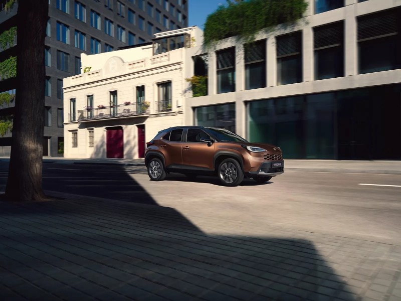 new Toyota Yaris Cross driving down road