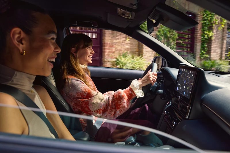 new Toyota Yaris Cross driving down road