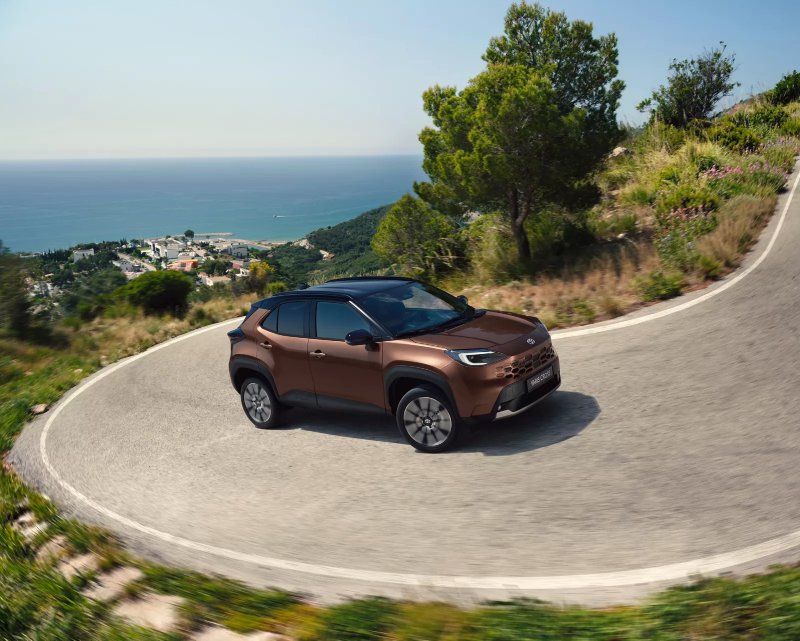 new Toyota Yaris Cross driving around the bend