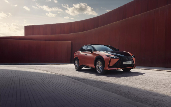 Bronze Lexus SUV Parked Outside a Modern Building