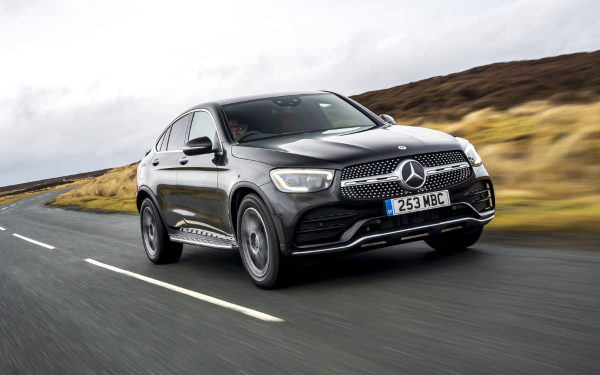 Black Mercedes-Benz GLC Coupé Driving on a Rural Road