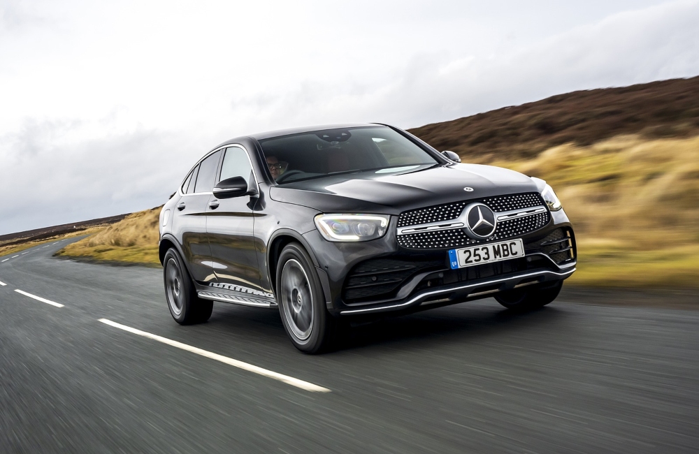 Black Mercedes-Benz GLC Coupé Driving on a Rural Road