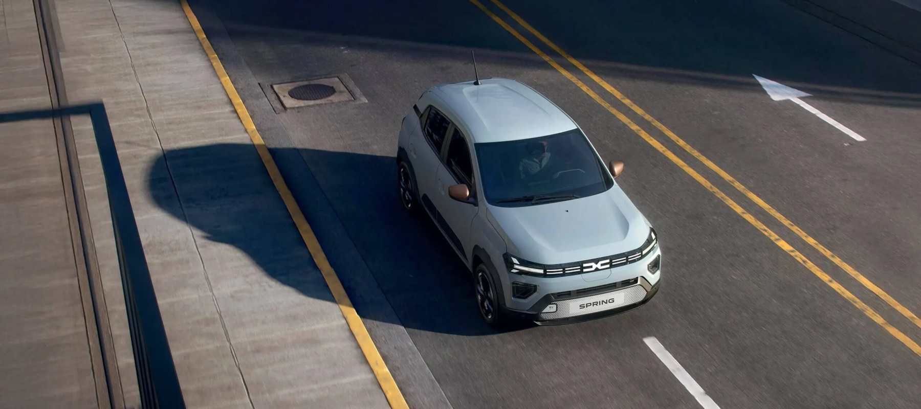 Dacia Spring Driving on the Road