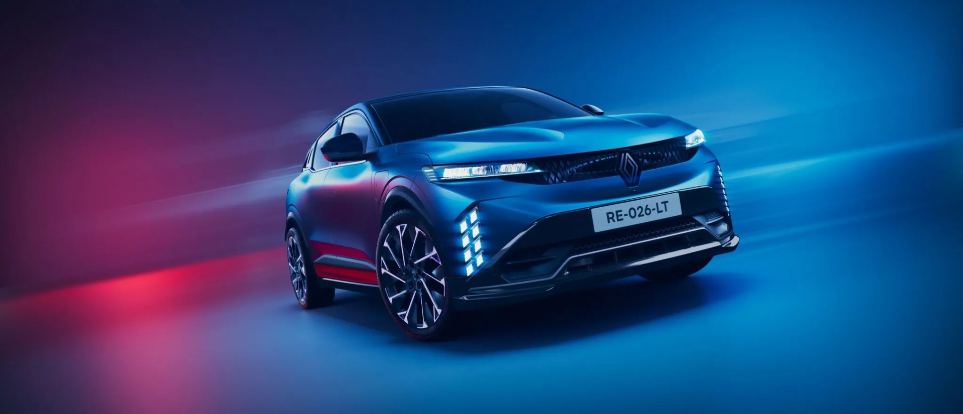 A photoshoot of the new Renault Megane E-Tech Electric with a colourful background, showing off the front facade.
