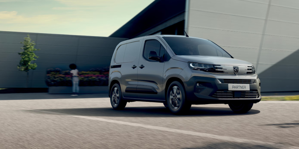 Peugeot Partner Parked Outside a Building