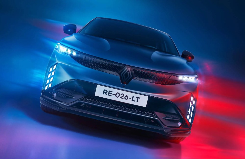 Front facing shot of a Renault Megane with turned on LED lighting and headlights, with a colourful background.