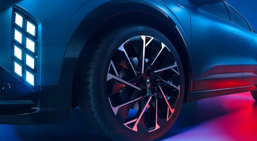 Close up shot of the LED lighting and alloy wheel of a Renault Megane E-Tech Electric.