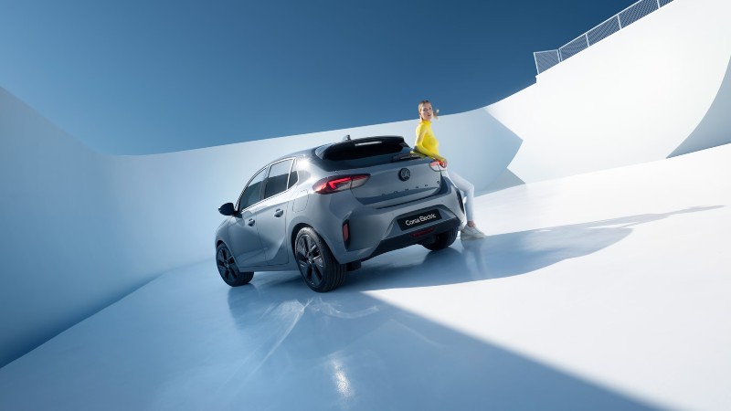 New Vauxhall Corsa Electric from the rear with woman in view