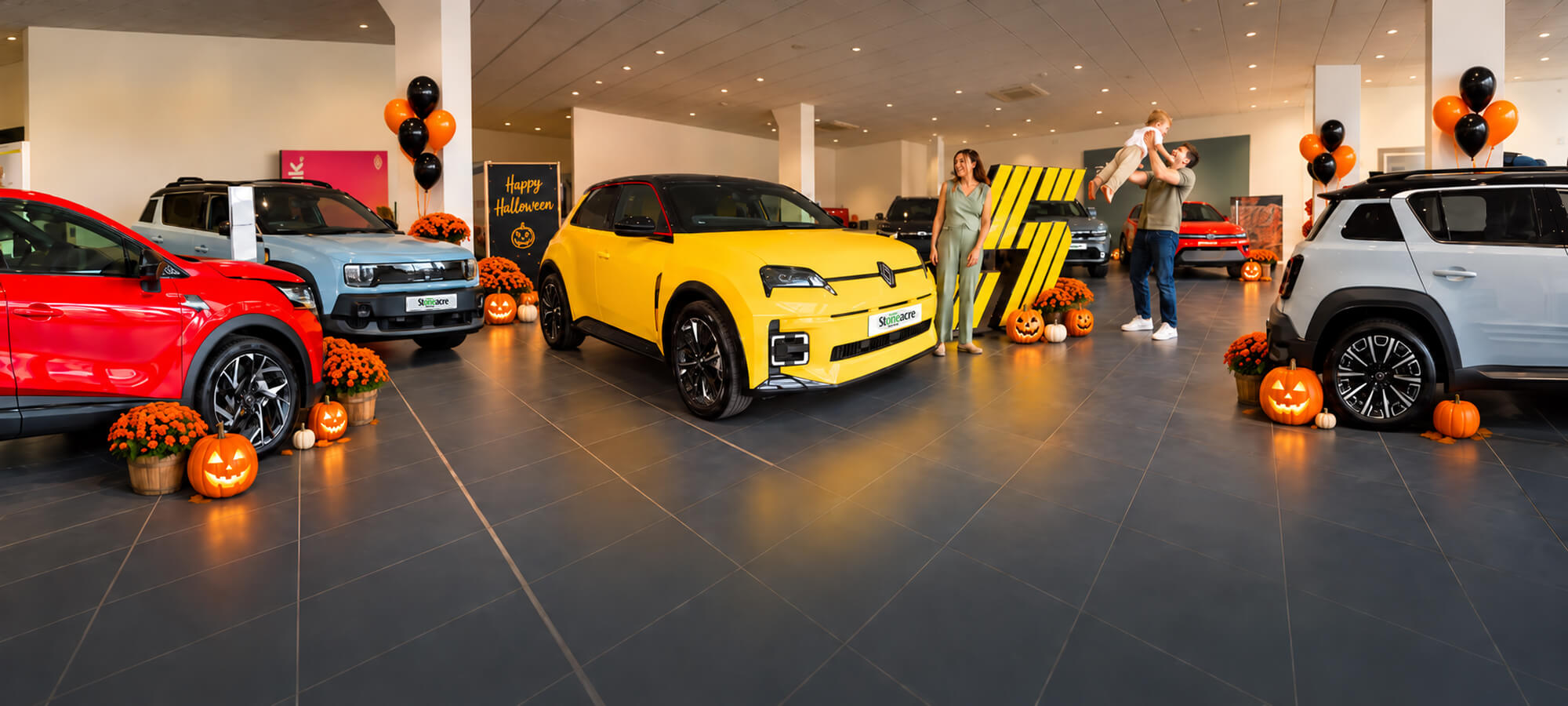 Stoneacre halloween homepage banner featuring cars in a showroom from Renault and Dacia