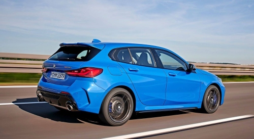 Blue BMW 1 Series third generation driving along a road; Used Series 1 BMW for sale