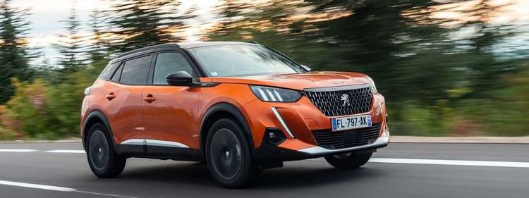 peugeot-2008-orange-driving-country-road