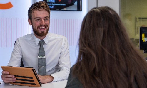Stoneacre car dealership; sales person talking to a customer