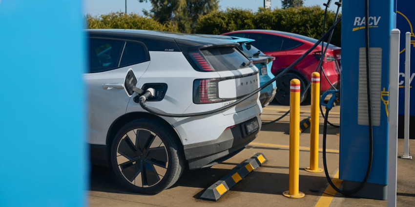 A Volvo EX30 charges in a charging bay; Motorway EV charging image