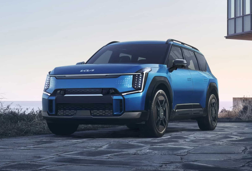 A blue Kia EV parked on paving; EV Home charging requirements image