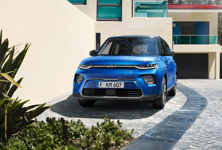A blue Kia Soul EV parked outside a contemporary home; EV home charger survey image