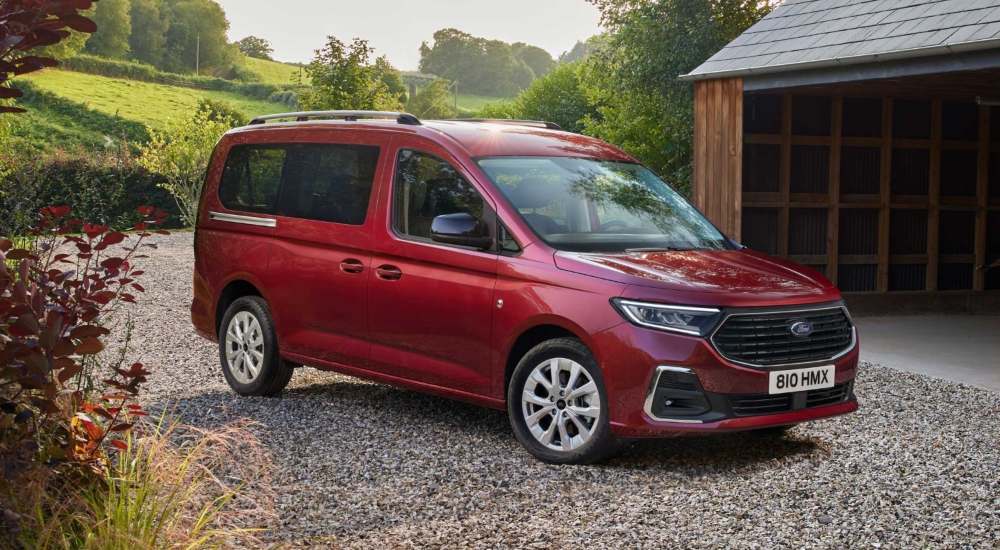 Ford Tourneo Connect Titanium in Maple Red, front three-quarter view.