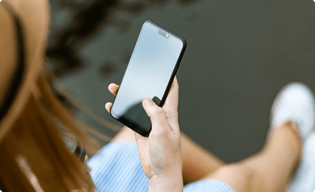 A person checks their mobile phone