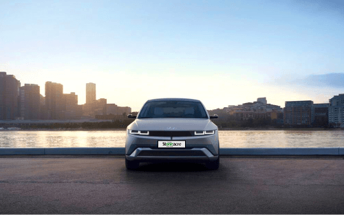 A Hyundai Ioniq 5 next to water; Startline Motor Finance at Stoneacre image