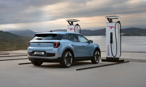 Used Ford Explorer Electric Car Used Ford Explorer electric car plugged in at IONITY fast charger.