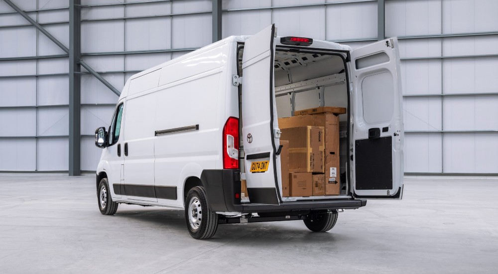 The new Toyota Proace Max, white panel van, rear three-quarter view.