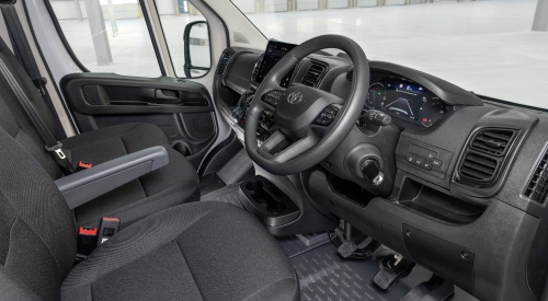 Proace Max Interior The new Toyota Proace Max interior, showing the driver’s seat, steering wheel, and digital dashboard.