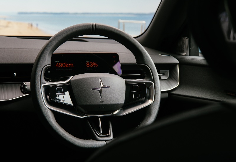 Interior of a used Polestar 3, showing the dashboard, digital display, and steering wheel.