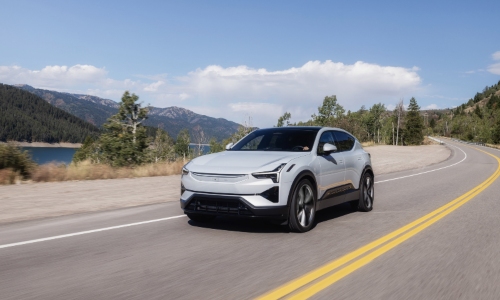 Approved Used Polestar 3 Approved used Polestar 3 driving on a mountain road.