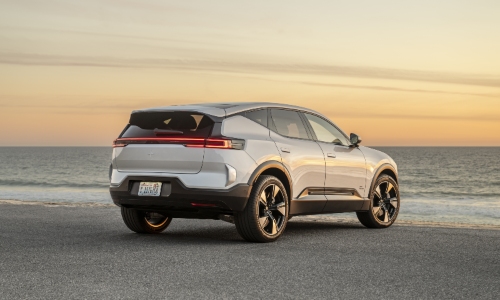 Used Polestar 3 Price Rear view of a used Polestar 3 premium SUV near the beach.