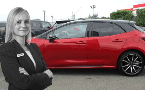 A woman stands in front of a red Toyota Corolla; What Do I Need to Finance a Used Car image