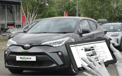 A tablet in front of a Toyota C-HR; How to Choose the Right Used Car Finance Deal - image