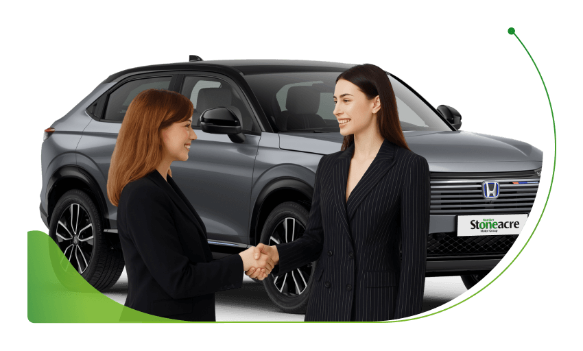 Two women shake hands in front of a grey Honda HR-V; Applying for 0% interest car finance image