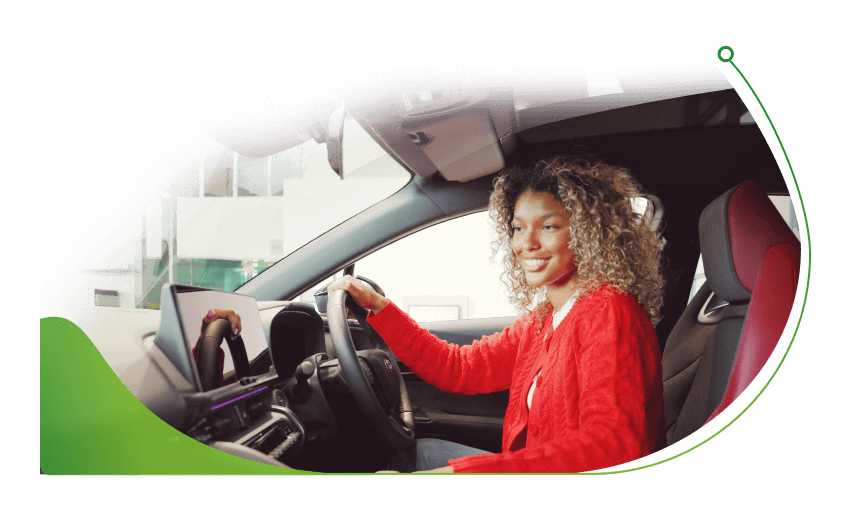 A woman sits in the driver's seat of a car; Pay as you go Car Finance for Bad Credit image
