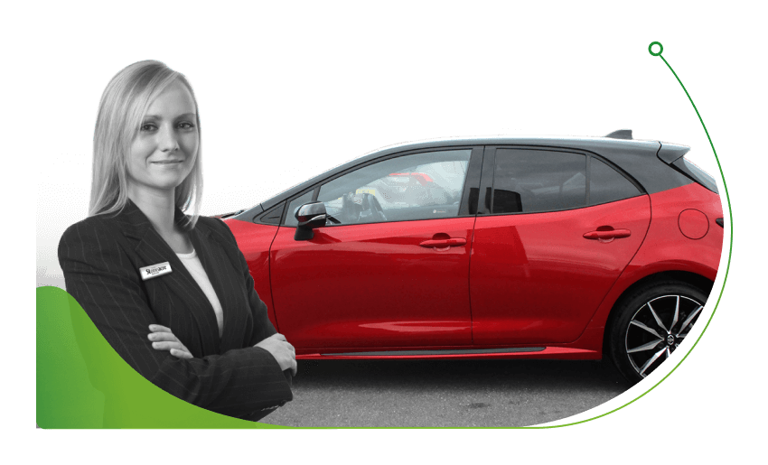 A woman stands in front of a red Toyota Corolla; What Do I Need to Finance a Used Car image