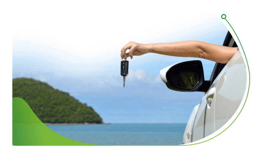 A driver holds a car key our of a car window; Oodle Car Finance at Stoneacre image