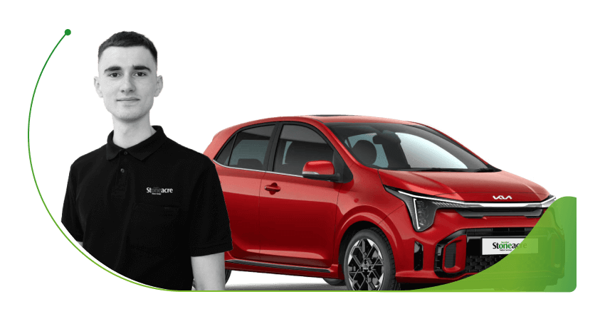 A Stoneacre employee in front of a red Kia Picanto; Can you get car finance with poor credit image
