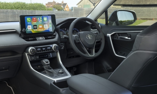 Used Toyota RAV4 Hybrid Interior Used Toyota RAV4 Hybrid interior with a touchscreen, leather steering wheel and seats.