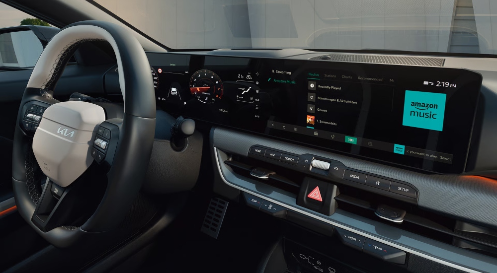 The Kia K4 dashboard with the triplescreen display