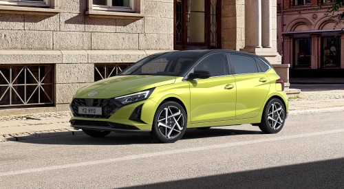 New Hyundai i20 parked on the side of a city building New Hyundai i20 parked on the side of a city building