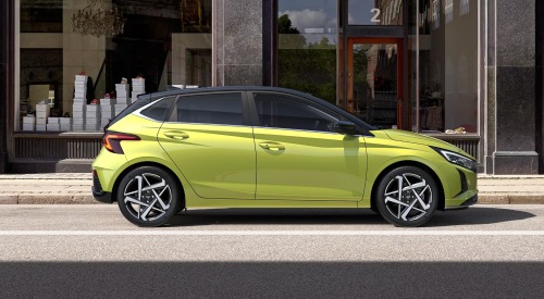 Side profile of a new Hyundai i20, parked on the side of a city street Side profile of a new Hyundai i20, parked on the side of a city street