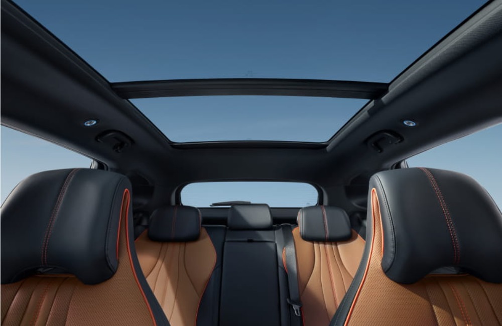 The interior of a new BYD SEAL U DM-i, showing the seats, headrests, and panoramic sunroof