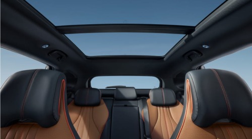 The interior of a new BYD SEAL U DM-i, showing the seats, headrests, and panoramic sunroof