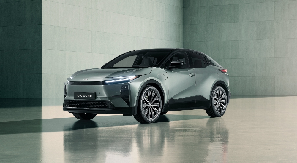 Front of the New Toyota C-HR+ for sale in Mineral paint with bi-tone black roof, highlighting the hammerhead design.