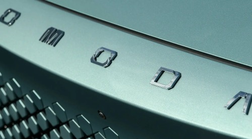 Close-up of the front of a new OMODA car, showing off the OMODA badging and hexagonal grille