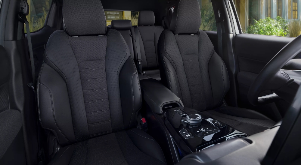 Toyota Urban Cruiser interior with fabric seats, a centre console and armrest.