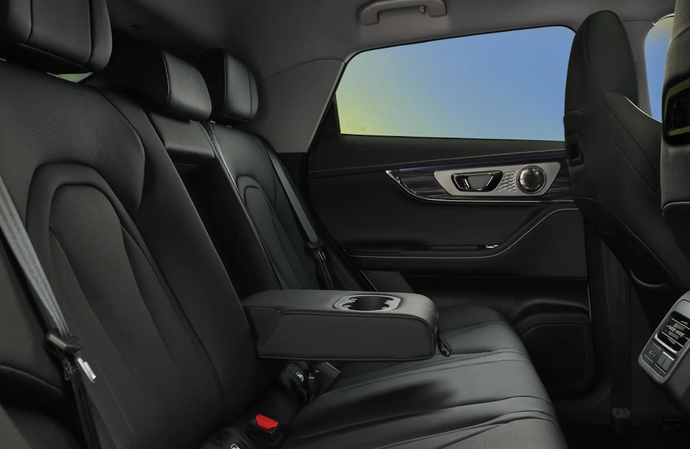 Interior of a new OMODA 5 car, showing the rear seats and centre arm rest