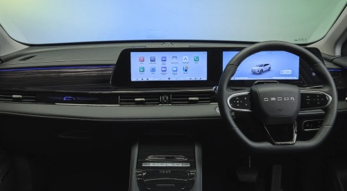A picture showing the new OMODA 5 interior, including the steering wheel, infotainment system, and centre console.