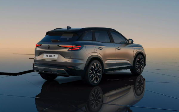 Rear three-quarter view of a Renault Austral E-Tech SUV in dual-tone matte Shadow Grey with a Diamond Black roof.