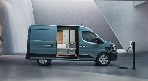 A blue new Renault Master E-Tech Electric Panel Van charging showcasing its load capacity