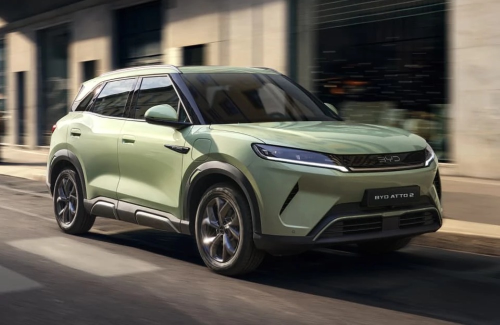 A BYD car going at speed down a city street