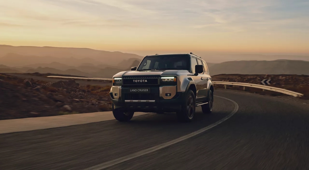 Toyota Land Cruiser Commercial in Sand driving along a desert road.